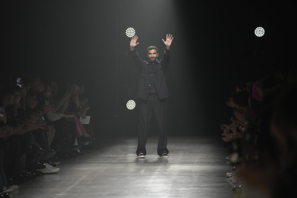 Creative director of the brand Giorgio Mallone acknowledges the applause at the end of of the Family First menswear Fall-Winter 2023-24 collection presented in Milan, Italy, Friday, Jan. 13, 2023. (AP Photo/Luca Bruno)