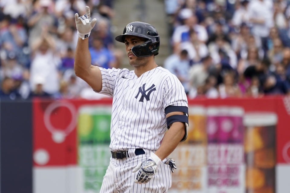 New York Yankees' Giancarlo Stanton gestures after hitting an RBI-double in the third inning of a baseball game against the Chicago Cubs, Sunday, June 12, 2022, in New York. (AP Photo/Mary Altaffer)