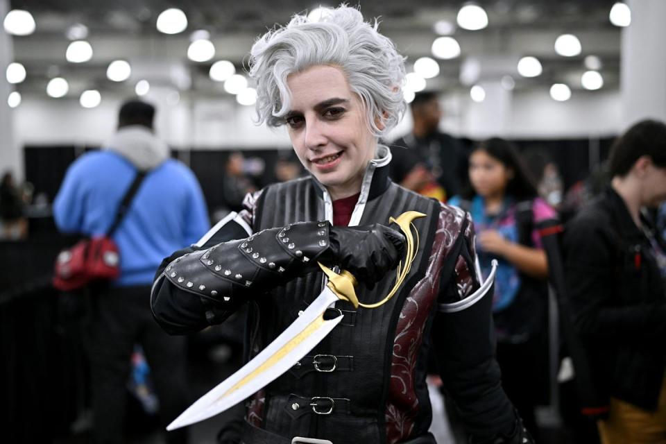 A cosplayer dressed as Asterion from ‘Baldur’s Gate 3’ at New York Comic Con in October 2023. <a href="https://www.gettyimages.com/detail/news-photo/cosplayer-posing-as-asterion-from-baldurs-gate-3-as-star-news-photo/1735879642?adppopup=true" rel="nofollow noopener" target="_blank" data-ylk="slk:Roy Rochlin/Getty Images;elm:context_link;itc:0;sec:content-canvas" class="link ">Roy Rochlin/Getty Images</a>