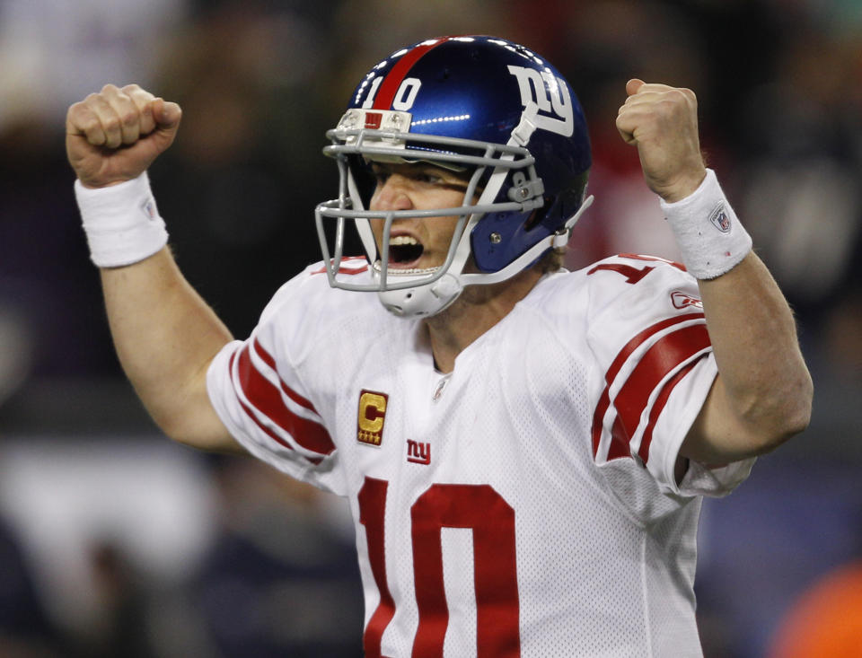 FILE - New York Giants quarterback Eli Manning celebrates his touchdown pass to tight end Jake Ballard in the last minute of an NFL football game against the New England Patriots in Foxborough, Mass., Sunday, Nov. 6, 2011. (AP Photo/Charles Krupa, File)