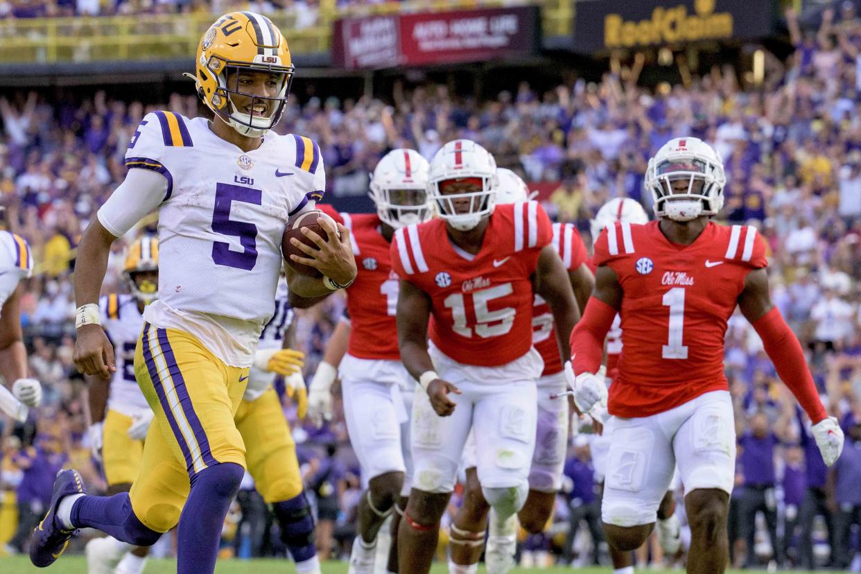 LSU quarterback Jayden Daniels (5) was all smiles as he led his team to an impressive 45-20 win over No. 7 Ole Miss in Baton Rouge, La., Saturday, Oct. 22, 2022. (AP Photo/Matthew Hinton)