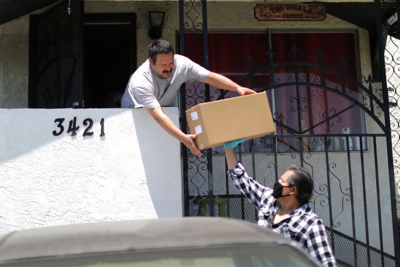 Taxi driver Gomez delivers food from the Westin Bonaventure hotel to at-risk seniors as the global outbreak of the coronavirus disease (COVID-19) continues in Los Angeles