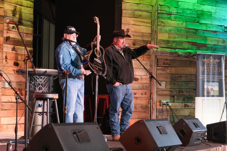 A guitar signed by Michael Martin Murphey is auctioned off Sunday evening at the Rangeland Fire Relief Benefit Concert at the Starlight Ranch in Amarillo.