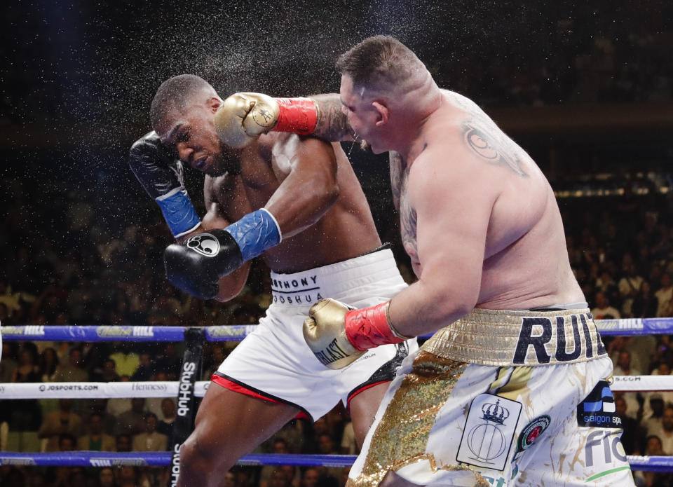 Andy Ruiz, right, punches Anthony Joshua during the seventh round of a heavyweight championship boxing match Saturday, June 1, 2019, in New York. Ruiz won in the seventh round. (AP Photo/Frank Franklin II)