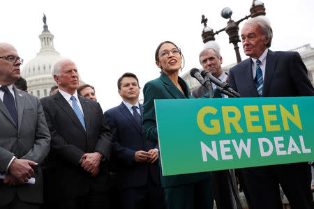 FILE PHOTO: U.S. Representative Alexandria Ocasio-Cortez and Senator Ed Markey hold a news conference for their proposed 'Green New Deal' to achieve net-zero greenhouse gas emissions in 10 years, at the U.S. Capitol in Washington, Feb. 7, 2019