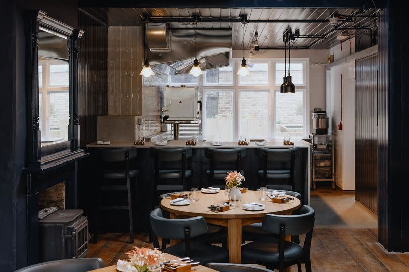 The new restaurant opening in Tunbridge Wells - lovely wooden floors and tables, dark grey seating, and window at the end