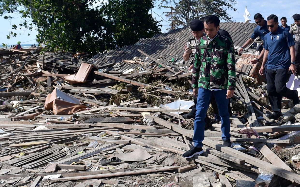 Indonesian President Joko Widodo vists the area affected by an earthqquake and tsunami in Palu - REUTERS