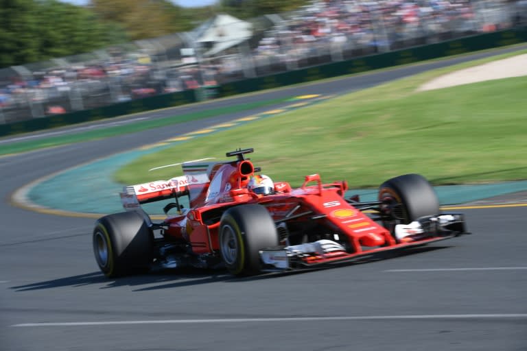 Ferrari's German driver Sebastian Vettel powers through a curve during the Formula One Australian Grand Prix in Melbourne