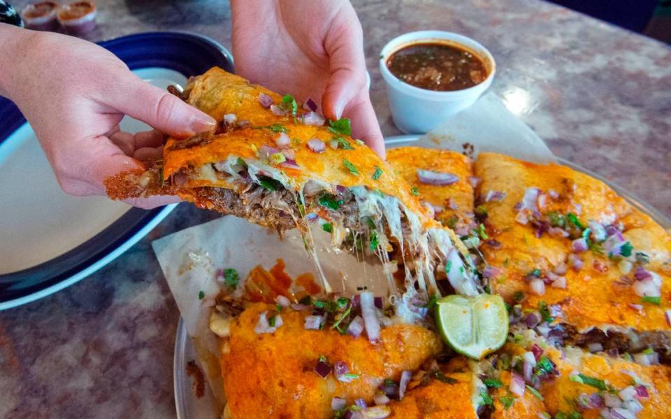 The “pizzacoa” at Los Tamales is a quesadilla-like creation featuring layers of marinated beef (barbacoa), cheese and tortillas topped with red onion, cilantro and lime.