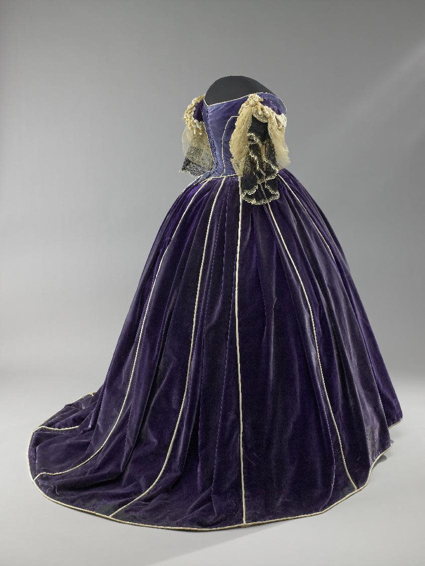 This undated image provided by the Smithsonian’s National Museum of American History shows Mary Todd Lincoln's purple velvet gown from “The First Ladies” exhibit. The gown was made by her seamstress and confidante, Elizabeth Keckley, an African-American woman who had purchased her own freedom. It’s one a number of artifacts associated with President Lincoln and his family in the Smithsonian collection. (AP Photo/Smithsonian’s National Museum of American History)