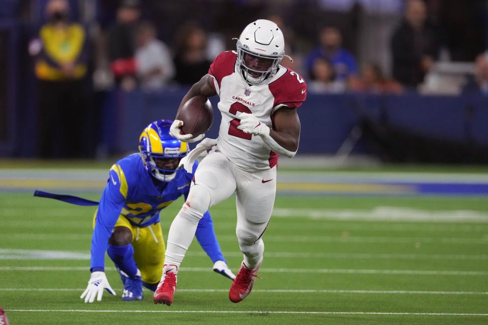 Arizona Cardinals running back Chase Edmonds (2) carries the ball against the Los Angeles Rams during the first half of an NFC Wild Card playoff football game at SoFi Stadium.