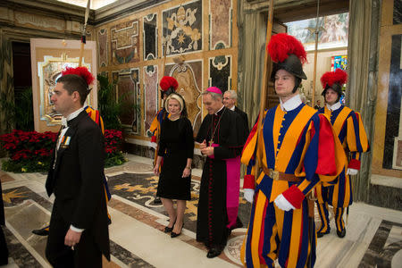 U.S. ambassador to the Vatican Callista Gingrich arrives to meet Pope Francis as she is flanked by Archbishop Georg Gaenswein at the Vatican December 22, 2017. Osservatore Romano/Handout via Reuters