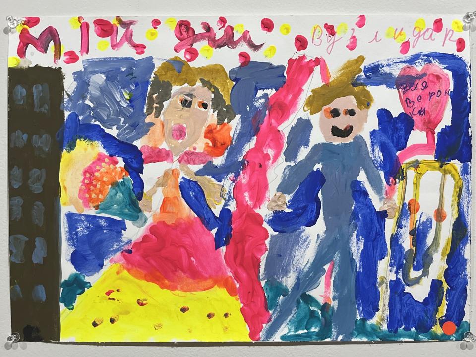 A Ukrainian child's artwork showing her in a bright gown