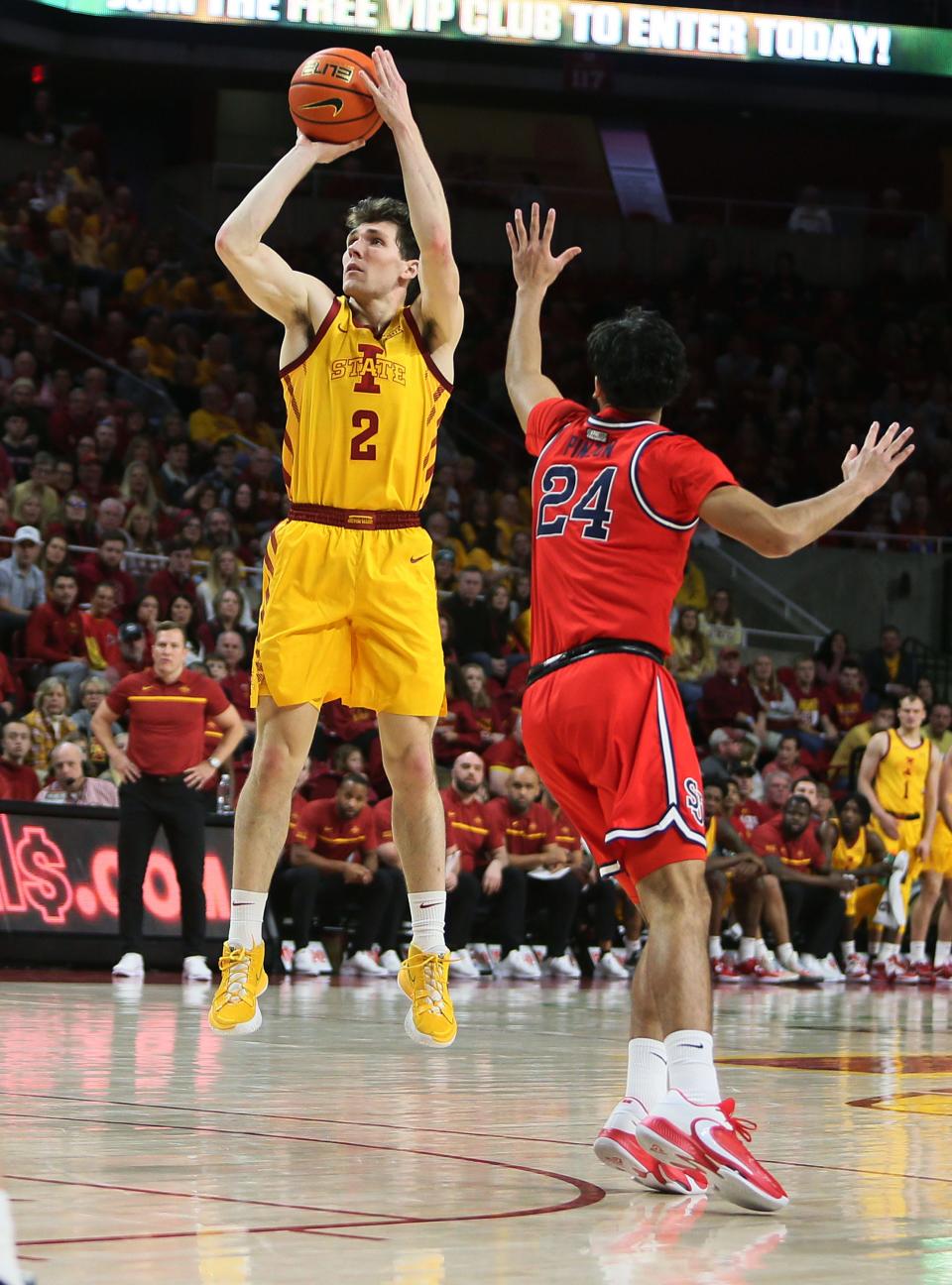 No. 23 Iowa State's Caleb Grill makes a three-point basket against St. John's Sunday.