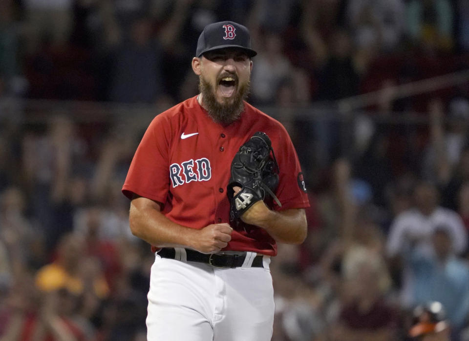 Boston Red Sox relief pitcher John Schreiber reacts after getting the final out against the Baltimore Orioles in a baseball game at Fenway Park, Thursday, Aug. 11, 2022, in Boston. (AP Photo/Mary Schwalm)