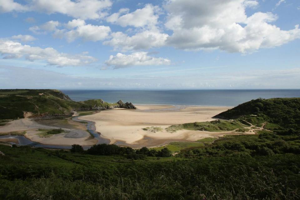 A view of Three Cliffs Bay beach in Swansea, which topped the list (PA)