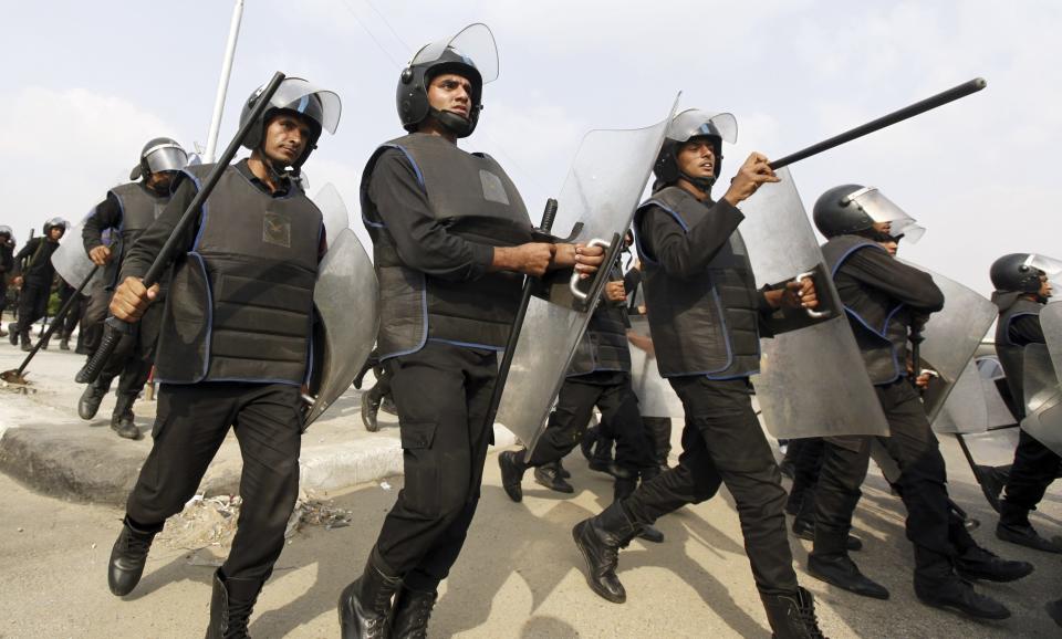 Riot police are seen on al-Azhar university during clashes with student protesters in Cairo October 30, 2013. Egyptian police fired teargas at protesting students at Cairo's al-Azhar university on Wednesday hours after authorities announced the detention of Muslim Brotherhood leader Essam El-Erian, part of a crackdown against the Islamist movement. (REUTERS/Mohamed Abd El Ghany)