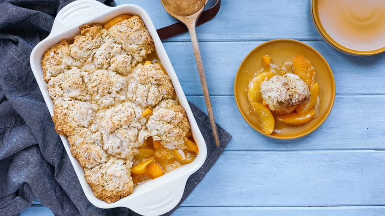 peach cobbler in baking dish