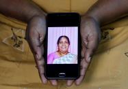 The Wider Image: Indians share the stories of loved ones they lost to the pandemic