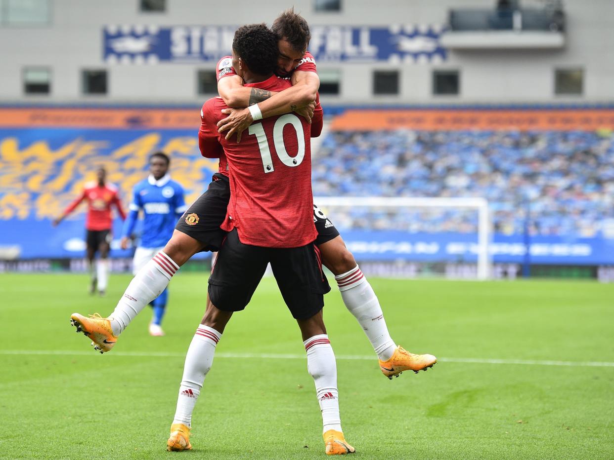 Marcus Rashford celebrates his goal with Bruno Fernandes (EPA)