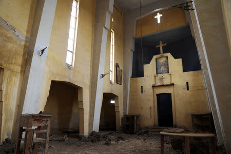 The interior of a deserted church is seen in an area recently cleared of mines and unexploded ordnance in a project to clear the area near Qasr Al-Yahud, a traditional baptism site along the Jordan River, near Jericho in the occupied West Bank, December 9, 2018. REUTERS/Ammar Awad