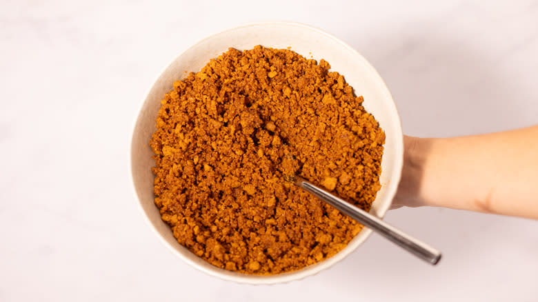 crumbled Biscoff biscuits in bowl 