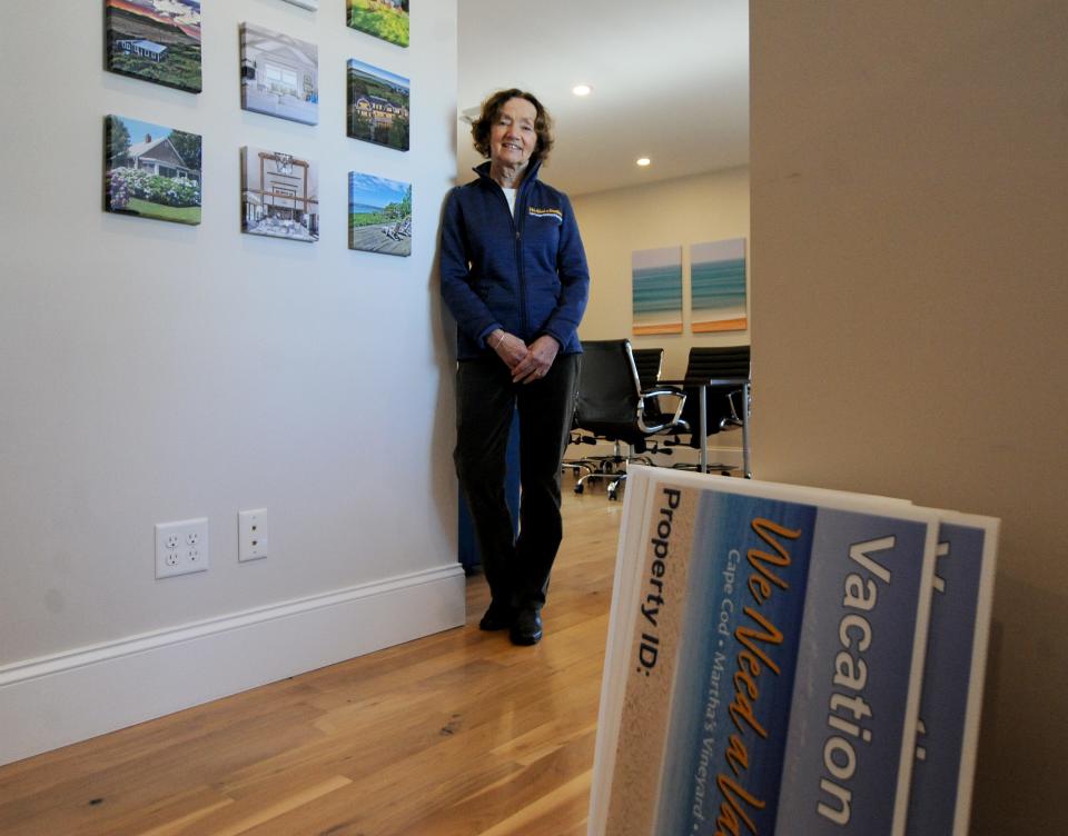 Joan Talmadge and her husband Jeffrey are co-owners of WeNeedaVacation. She was photographed at her Orleans office where photos of various home rentals hang on the walls.