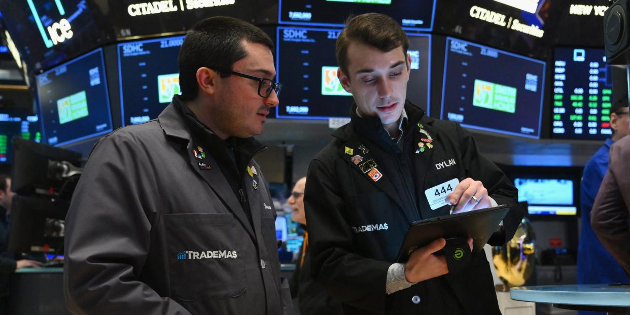 Traders work on the floor of the New York Stock Exchange (NYSE) during morning trading on January 11, 2024 in New York City.