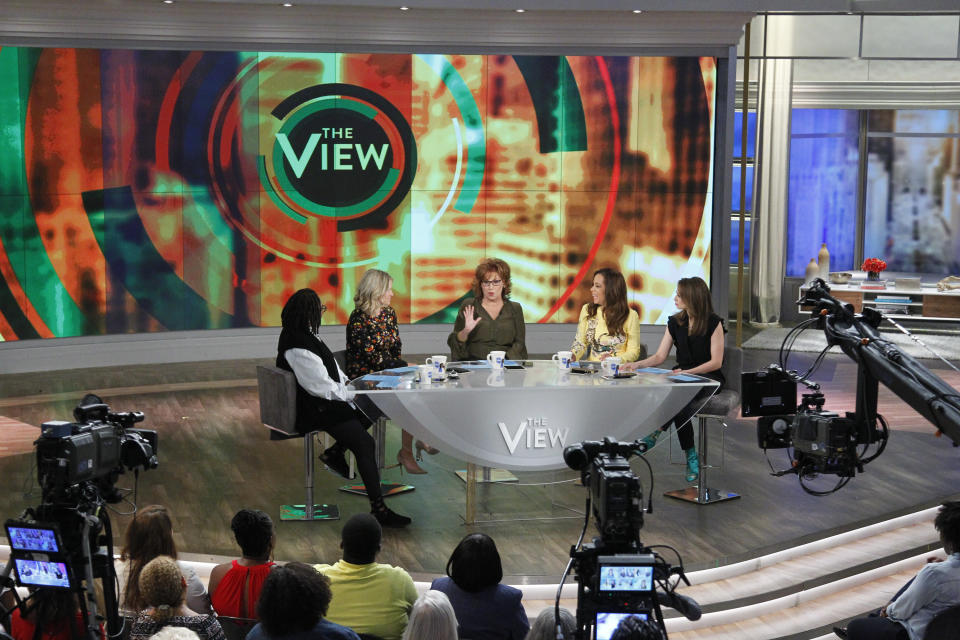 Bila&nbsp;sits across the table from longtime "View" co-host Whoopi Goldberg.