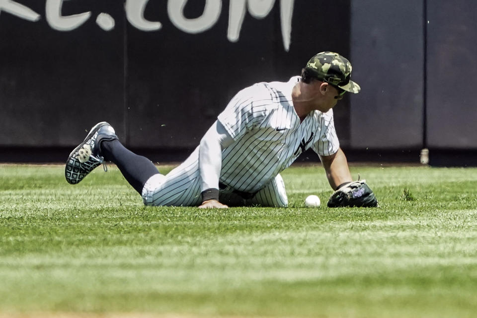 New York Yankees right fielder Aaron Judge (99) can't make the catch during the first inning of a baseball game against Chicago White Sox, Saturday, May 21, 2022, in New York. (AP Photo/Bebeto Matthews)