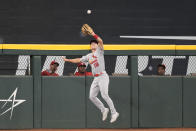 St. Louis Cardinals center fielder Tommy Edman (19) catches the fly-out hit by Texas Rangers' Jonah Heim during the eighth inning of a baseball game, Wednesday, June 7, 2023, in Arlington, Texas. (AP Photo/Jim Cowsert)