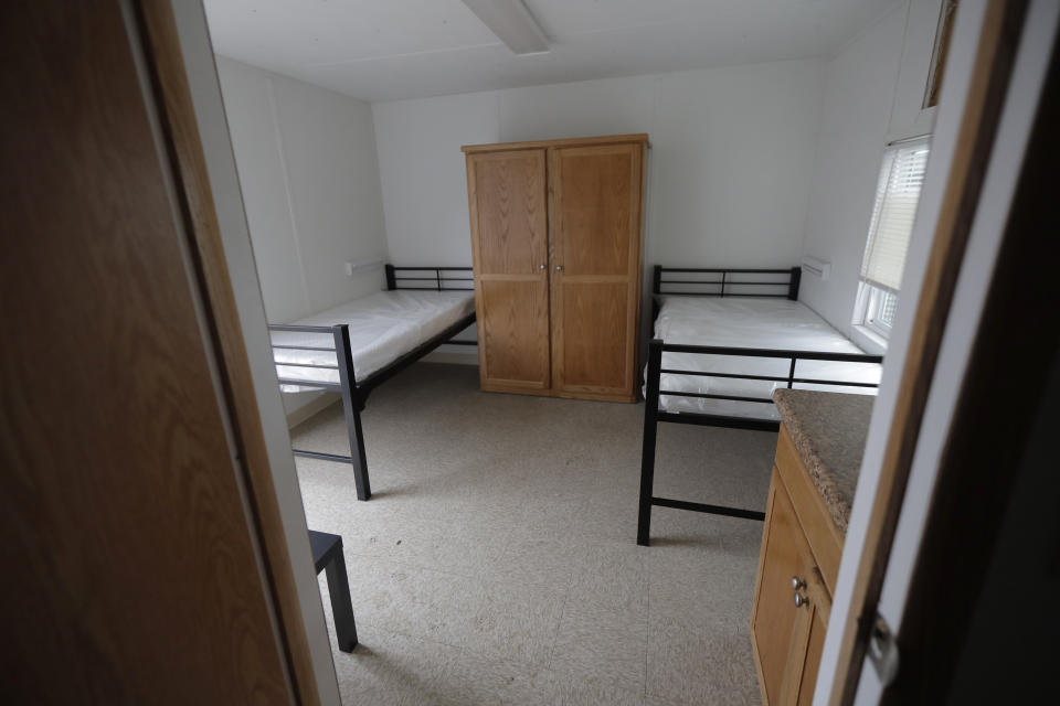 The interior of a two-bed temporary housing unit is shown Tuesday, March 3, 2020, at the site in South Seattle where King County will be placing several multi-unit housing modules to house patients undergoing treatment and isolation in response to the COVID-19 coronavirus. The units could be ready as soon as the end of the week. (AP Photo/Ted S. Warren)