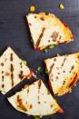 <p>Make a <a href="https://www.goodhousekeeping.com/food-recipes/healthy/g4895/healthy-quesadilla-recipes/" rel="nofollow noopener" target="_blank" data-ylk="slk:quesadilla;elm:context_link;itc:0;sec:content-canvas" class="link ">quesadilla</a> by spreading 1/4 cup fat-free refried beans over a 100% stone-ground corn tortilla. Sprinkle on 1 ounce shredded part-skim cheese. Top with salsa and another tortilla; microwave 45 seconds on high or grill. Serve with cucumber spears and 1/2 cup 2% cottage cheese or Greek yogurt topped with 2 clementines.</p>