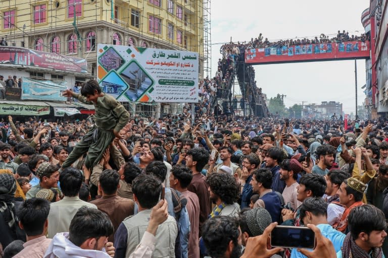 Afghan fans in Khost celebrate Afghanistan's win against Bangladesh at the T20 World Cup (-)