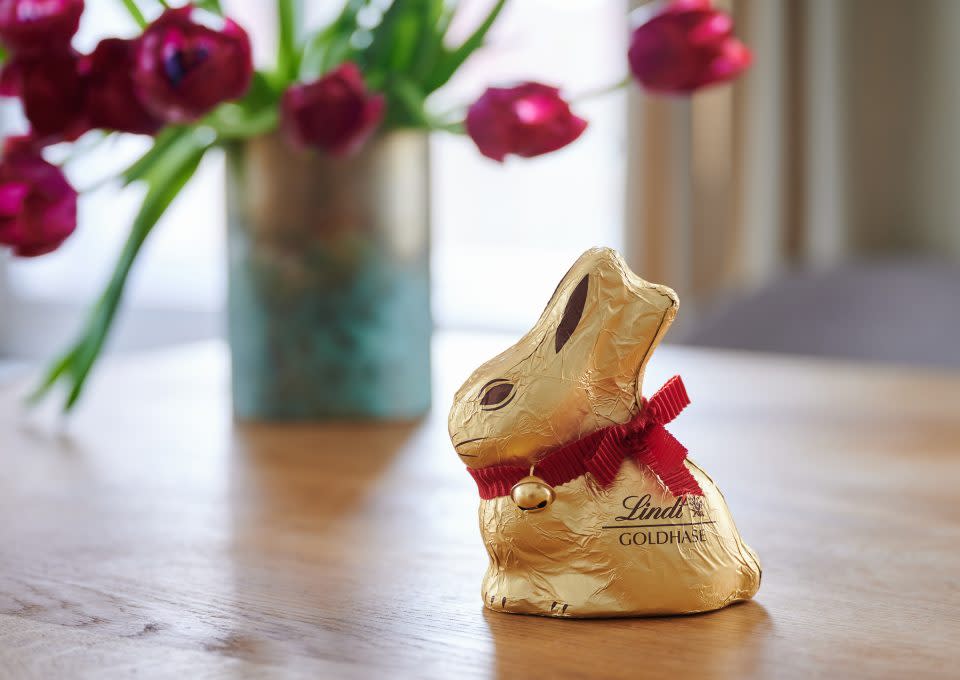 Easter bunny chocolate wrapped in gold and placed on a table