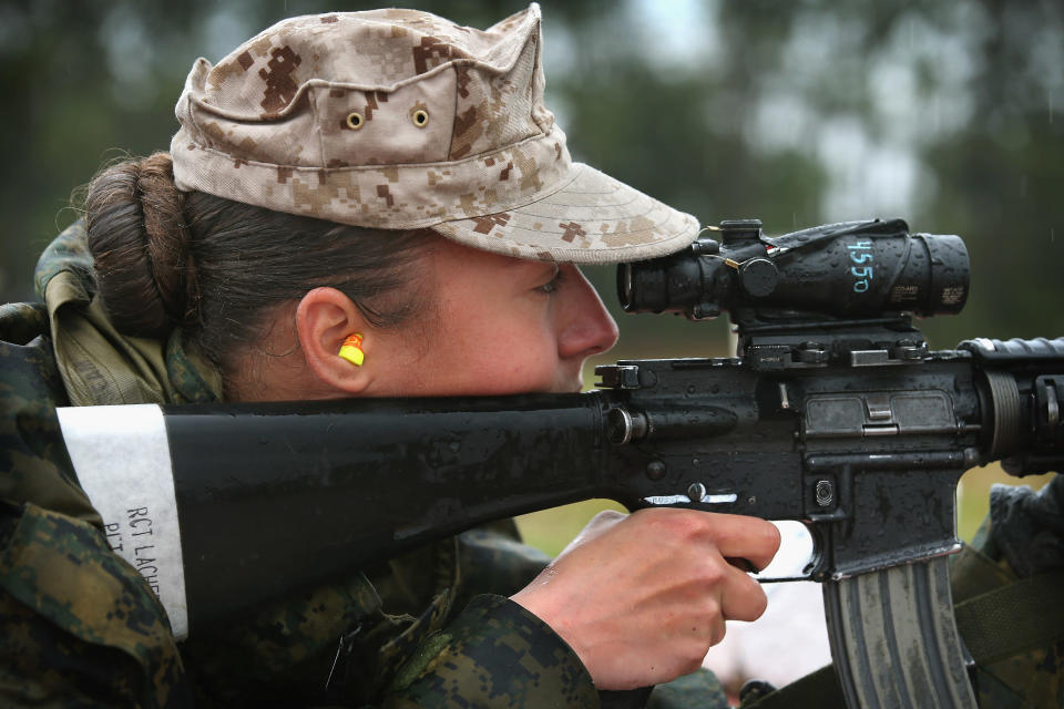 PARRIS ISLAND, SC - FEBRUARY 25: Marine recruit Cora Ann Lacher from Manuet, NY fires on the rifle range during boot camp February 25, 2013 at MCRD Parris Island, South Carolina. All female enlisted Marines and male Marines who were living east of the Mississippi River when they were recruited attend boot camp at Parris Island. About six percent of enlisted Marines are female. (Photo by Scott Olson/Getty Images)