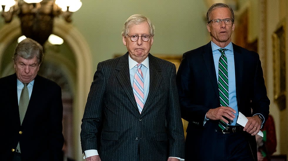 Minority Leader Mitch McConnell (R-Ky.) and Sen. John Thune (R-S.D.) arrive for a press conference after the weekly policy luncheon on Tuesday, March 22, 2022.