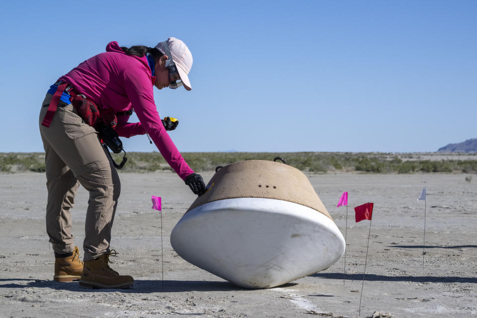 In this photo provided by NASA, recovery teams participate in field rehearsals to prepare for the retrieval of the sample return capsule from NASA's OSIRIS-REx mission at the Department of Defense's Utah Test and Training Range on Aug. 29, 2023. On Sunday, Sept. 24, 2023, the OSIRIS-REx spacecraft will fly by Earth and drop off what is expected to be at least a cupful of rubble it grabbed from the asteroid Bennu, closing out a seven-year quest. (Keegan Barber/NASA via AP)