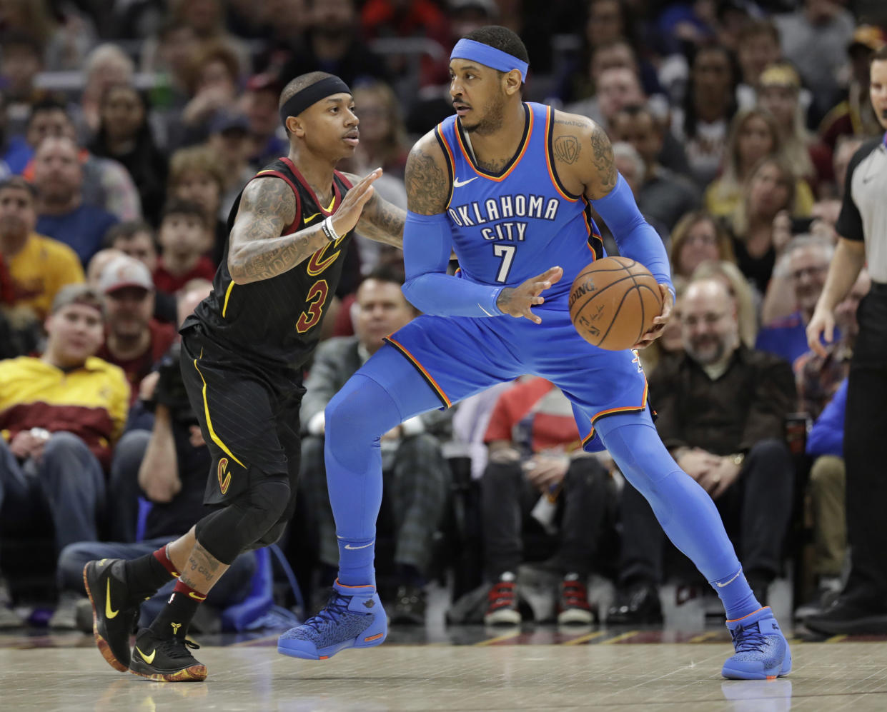 Oklahoma City Thunder’s Carmelo Anthony (7) drives against Cleveland Cavaliers’ Isaiah Thomas (3) in the first half of an NBA basketball game, Saturday, Jan. 20, 2018, in Cleveland. (AP Photo/Tony Dejak)