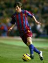<p>Lionel Messi plays the ball during a Primera Liga match between Cadiz and F.C. Barcelona on Dec. 17, 2005 at the Ramon de Carranza stadium in Cadiz, Spain. The athlete wore a pair of white and navy color-blocked cleats from Nike. </p>
