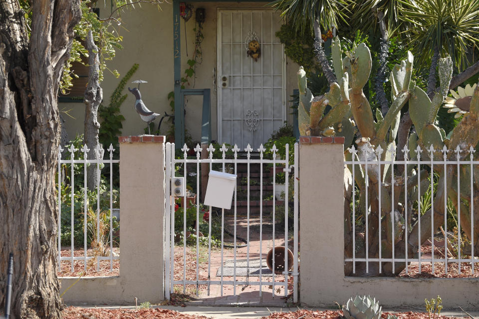 This photo shows the front entrance of Robert Chain's house in the Encino section of Los Angeles, Thursday, Aug. 30, 2018. Chain, who was upset about The Boston Globe's coordinated editorial response to President Donald Trump's attacks on the news media, was arrested Thursday for threatening to travel to the newspaper's offices and kill journalists, whom he called the "enemy of the people," federal prosecutors said. (AP Photo/Mark J. Terrill)