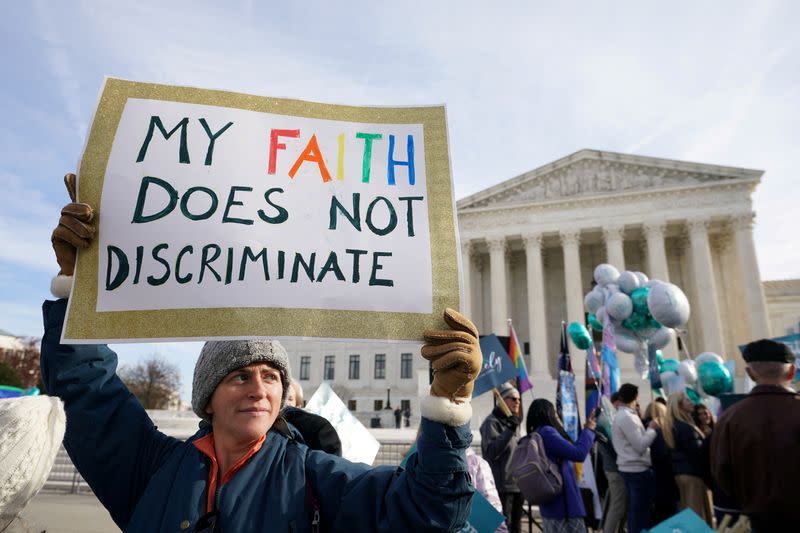 FILE PHOTO: Activists gather outside U.S. Supreme Court as justices hear arguments in case involving LGBT rights in Washington