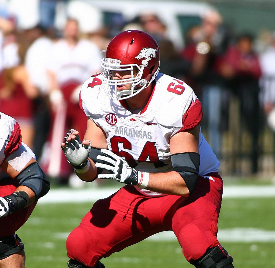 Nov 17, 2012; Starkville, MS, USA; Arkansas Razorbacks center Travis Swanson (64) during the game against the <a class="link " href="https://sports.yahoo.com/ncaaf/teams/mississippi-st/" data-i13n="sec:content-canvas;subsec:anchor_text;elm:context_link" data-ylk="slk:Mississippi State Bulldogs;sec:content-canvas;subsec:anchor_text;elm:context_link;itc:0">Mississippi State Bulldogs</a> at Davis Wade Stadium. Mississippi State Bulldogs defeated the Arkansas Razorbacks 45-14. Mandatory Credit: Spruce Derden–USA TODAY Sports