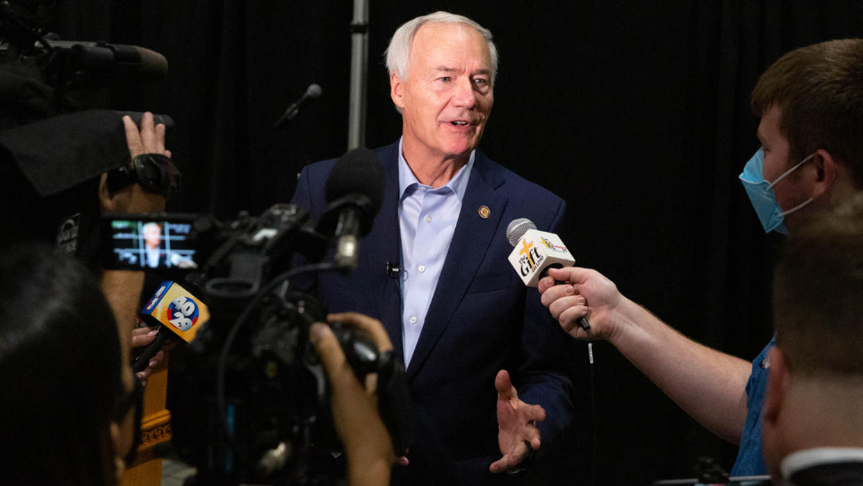 Asa Hutchinson, governor of Arkansas, speaks with members of the media following a community town hall to promote Covid-19 vaccinations at Arkansas State UniversityMountain Home (ASUMH) in Mountain Home, Arkansas, U.S., on Monday, July 16, 2021. (Liz Sanders/Bloomberg via Getty Images)