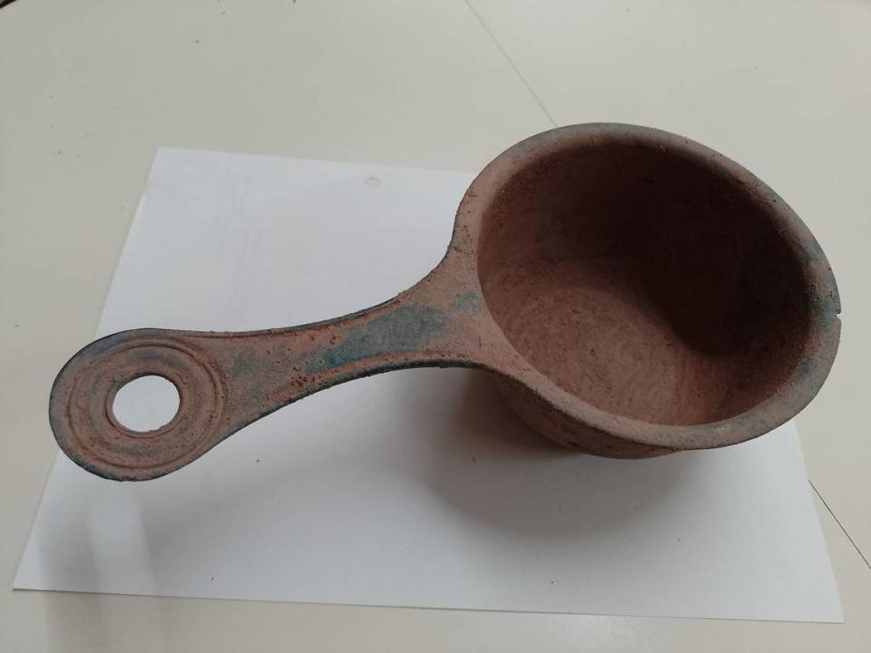The handle of an ancient Roman saucepan.