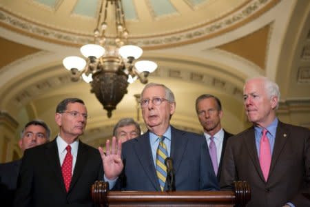 FILE PHOTO -  Flanked by fellow Republicans, Senate Majority Leader Mitch McConnell (R-KY) speaks to Capitol Hill reporters following the Republicans' weekly policy luncheon in Washington, U.S., July 31, 2018. REUTERS/Allison Shelley