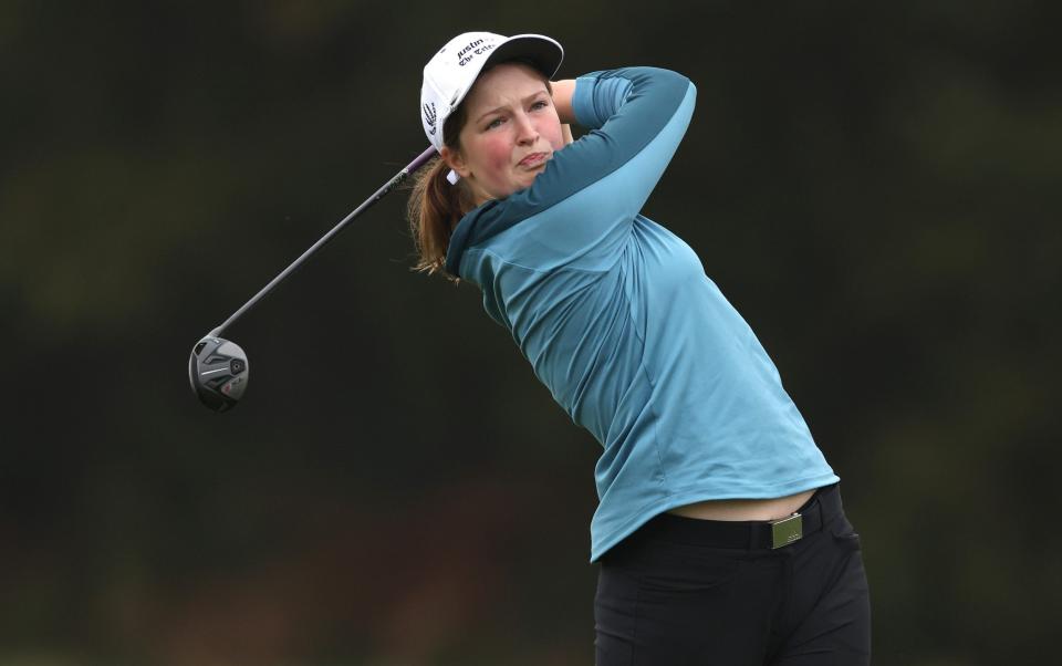 Lottie Woad in action during the Justin Rose Telegraph Junior Golf Championship at Walton Heath Golf Club - Getty Images