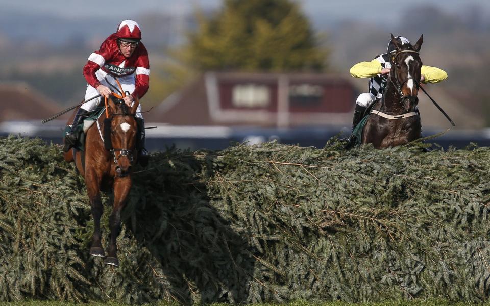 Davy Russell and Tiger Roll clear the last in the lead but had to hold off a storming finish from Pleasant Company, right, to win the 2018 Grand National - Getty Images Europe