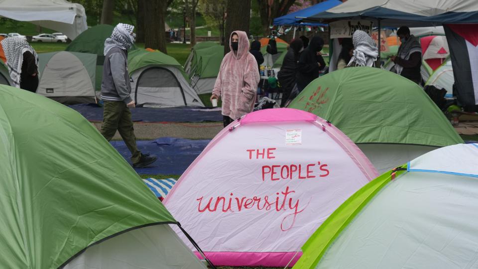 New Brunswick, NJ -- April 30, 2024 -- Rutgers students occupy tents and hold rallies outside Murray Hall as part of their protest in support of Palestinians affected by the war in Gaza.