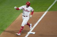 Philadelphia Phillies' Rhys Hoskins celebrates his home run during the fifth inning in Game 3 of baseball's World Series between the Houston Astros and the Philadelphia Phillies on Tuesday, Nov. 1, 2022, in Philadelphia. (AP Photo/Chris Szagola)